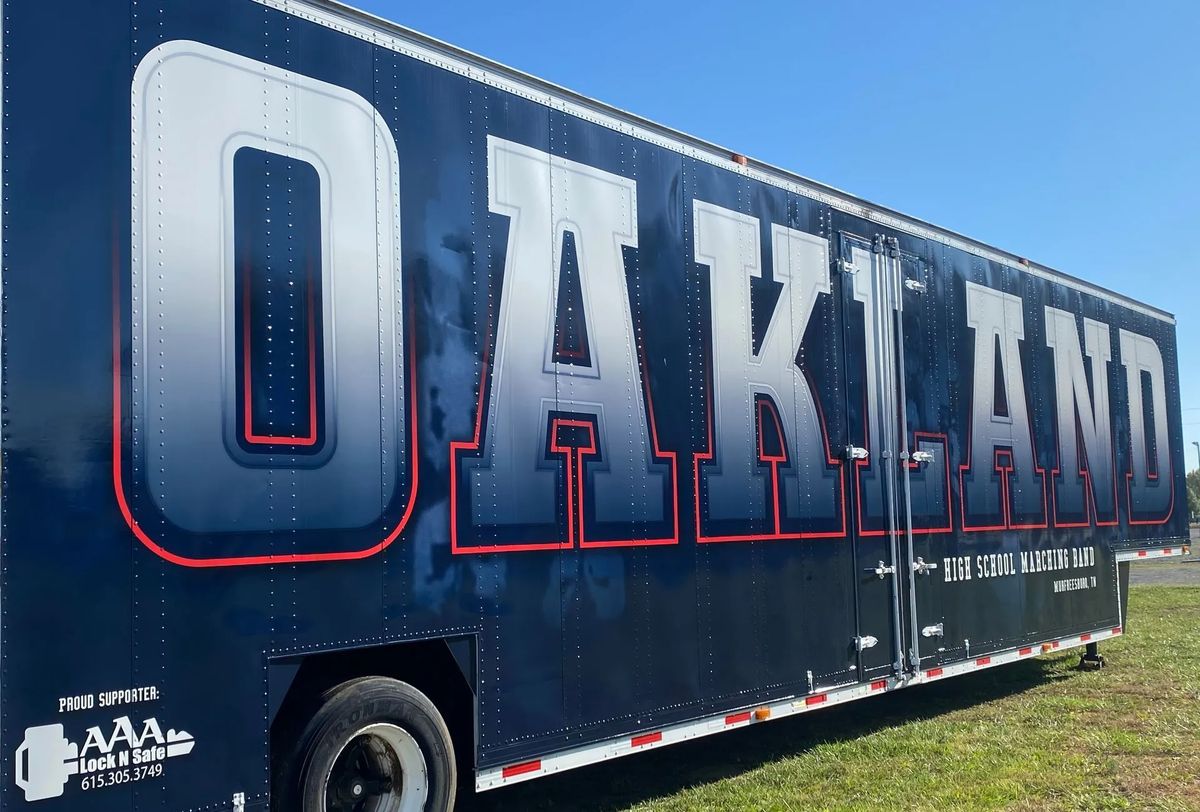 Oakland High School Marching Band trailer with AAA Lock N Safe listed as a proud supporter.