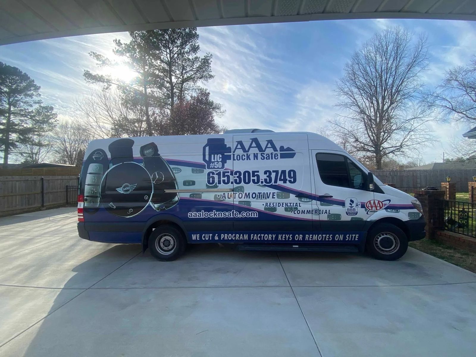 AAA Lock N Safe mobile locksmith van parked in a driveway.